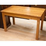 A solid elm topped dining table, raised on square legs