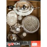 A collection of silver plate, comprising a three piece tea service, two dressing table jars, a