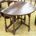 A late 17th century oak gateleg table, fitted with a single drawer