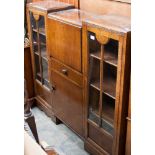 An Art Deco oak cabinet with glazed doors