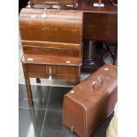 Two Singer table sewing machines and a sewing box