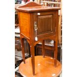 An Edwardian mahogany bedside cabinet, fitted with a single door