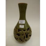 A celadon vase with reticulated central stand