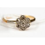 **RE-OFFER MAY 100/150**An 18ct gold and platinum petal diamond ring (seven diamonds)