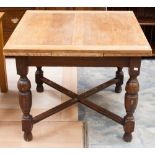 A Jacobean style oak draw leaf table