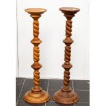 A matched pair of pine torcheres,