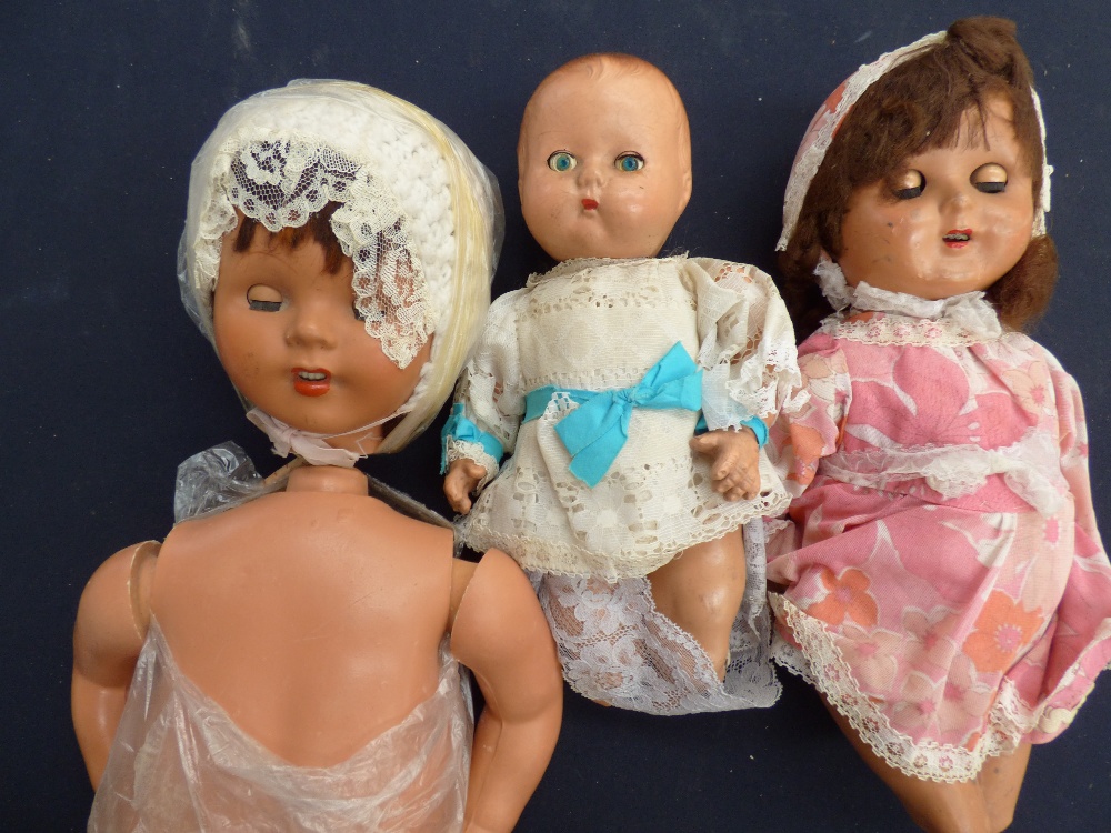 Three composition dolls, papier mache,
