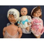 Three composition dolls, papier mache,