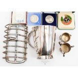 An Edwardian toastrack, 1930s tankard, with collection of coins, including 1977 Silver Jubilee