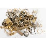 A collection of watch movements and parts for restoration and repair purposes,