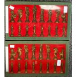 A heavy brass chess set in Chinoiserie style (two boxes, sixteen in each)