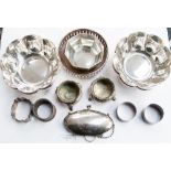 A collection of silver and silver plate, comprising an octagonal silver dish, two napkin rings,