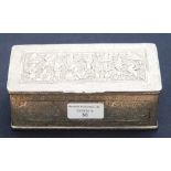 A Persian white metal casket or cigar box decorated with chased floral design, the lid with a