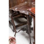 A mahogany two-tier occasional table, circa 1900, with a shaped top and lower tier,