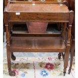 An early 20th century oak two-tier drinks trolley,