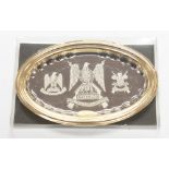 A framed picture of Royal Scots Dragoon Guard's badges in 24K gold rim frame