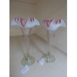 A pair of 20th Century Continental glass trumpet vases with overlay pink and white decoration onto