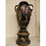 A Staffordshire tall vase with Japanesque detailing on a black ground, twin handled