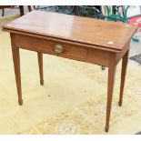 A George III mahogany fold-over tea table, fitted with a single drawer, the frieze inlaid with