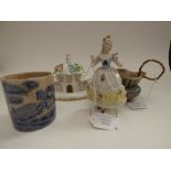 A small group of ceramics, comprising 'The Parasol House' by Coalport, a small Dresden figure, a