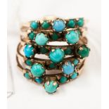 A five band turquoise ring set numerous graduated turquoise cabachon