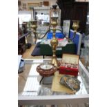 A three light, two branch brass candelabrum together with three AA badges,