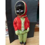 A coloured Pedigree Walkie Talkie doll, twenty inches approx and an album of cigarette cards