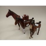 Three Beswick horses, all brown glazed, one matt and two gloss, model no.s 2421 (The Winner), 1261