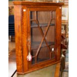 A George III style oak hanging corner cupboard, with applied glazing bars