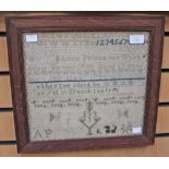 A George III embroidered sampler, dated 1784, fitted in an oak frame