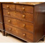 An early 19th Century mahogany chest of drawers, fitted with two short over three long graduated