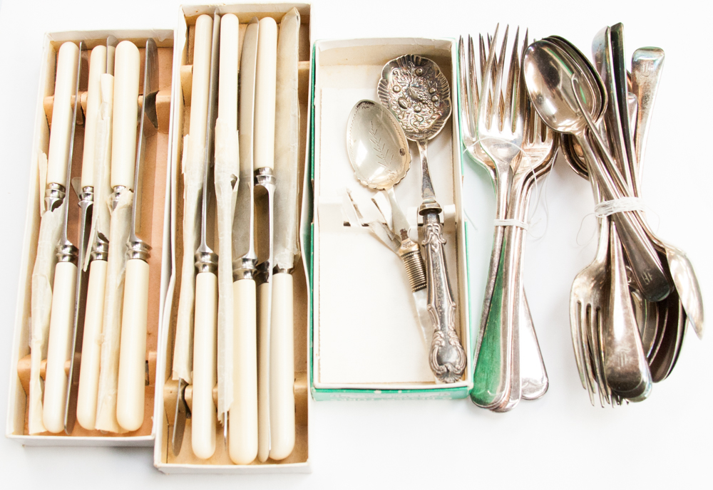 Four boxes of Sheffield cutlery together with a filled silver handles fruit spoon and a M.O.