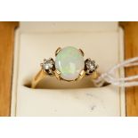 **RE-OFFER MAY 60/80**A 9ct opal and diamond ring