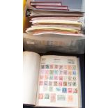 An accumulation of stamps in numerous albums and loose in bags