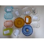 A collection of 14 intaglio glass trinket dishes