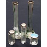 Three silver topped bottles/jars, one with blue enamelled top; together with a pair of Art Nouveau