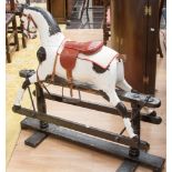 A Victorian style rocking horse, lacking maine and tail, repainted,