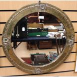 A circular brass hand hammered mirror - Edwardian in the French style