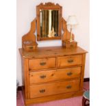 An Edwardian pine dressing chest, with an adjustable mirror and two small drawers, the base with