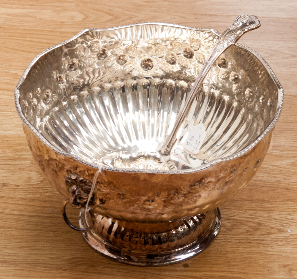 A large silver on copper punch bowl with two ring handles, with embossed decoration, 20 cm high 31