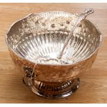 A large silver on copper punch bowl with two ring handles, with embossed decoration, 20 cm high 31