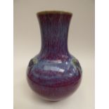 An oriental vase, blue/purple glaze,