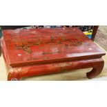 An Oriental red lacquer low table,