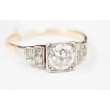 An Art Deco diamond ring with stepped mount, the central square set old-cut round diamond (approx.