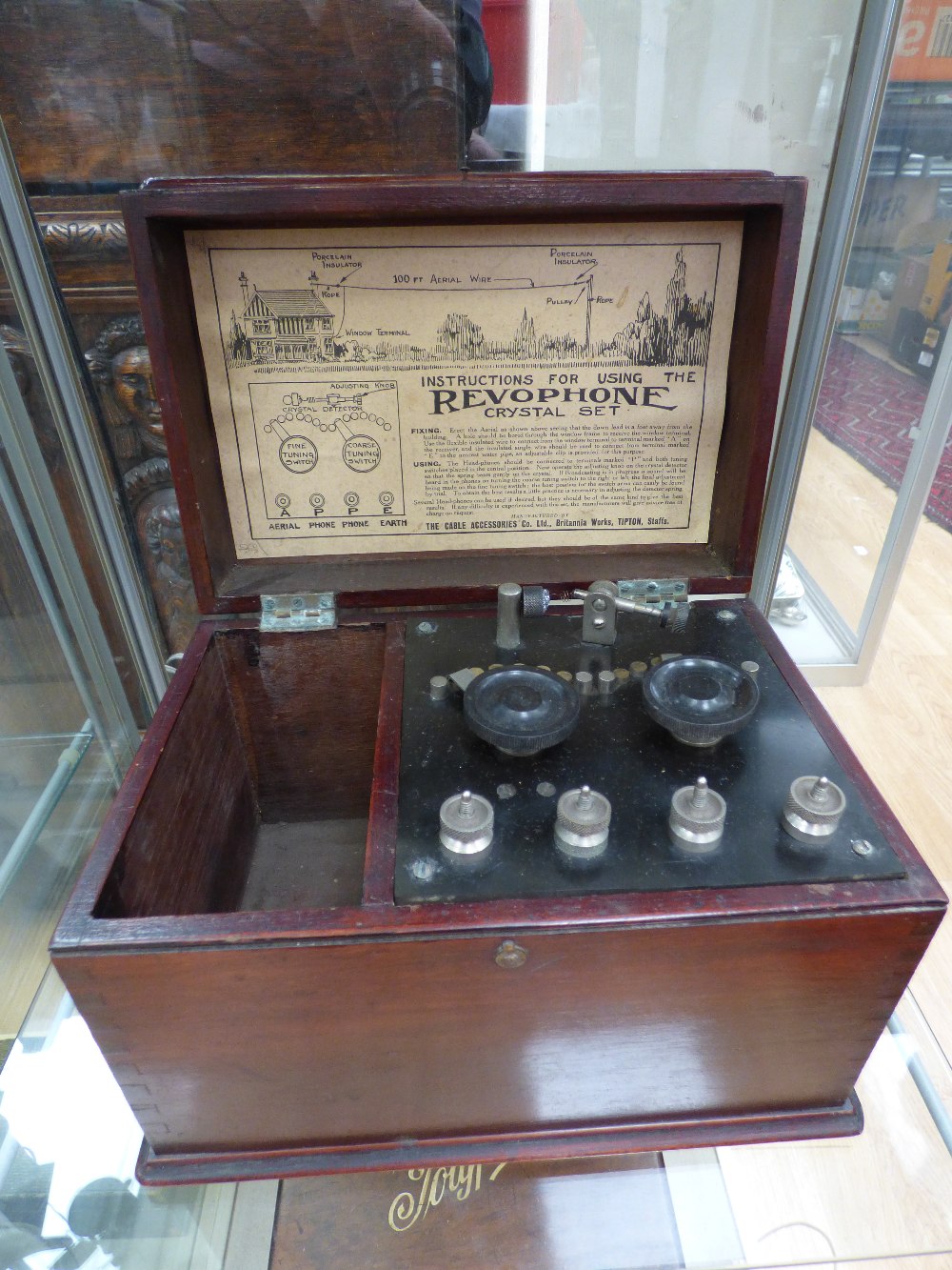 A Revophone crystal set, fitted in a mahogany case