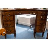 An Edwardian mahogany kidney shaped desk