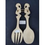 A pair of antique ivory salad servers (2)