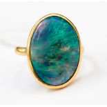 **RE-OFFER MAY 300/500**A black opal ring set oval cabochon with green, blue and purple fire,
