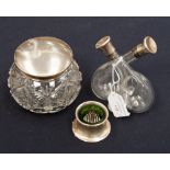 An early 20th century silver topped cut glass dressing table jar, a silver ink well and a silver