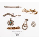 A rose gold 9ct knot bar brooch and yellow metal chain, silver pendants and chains